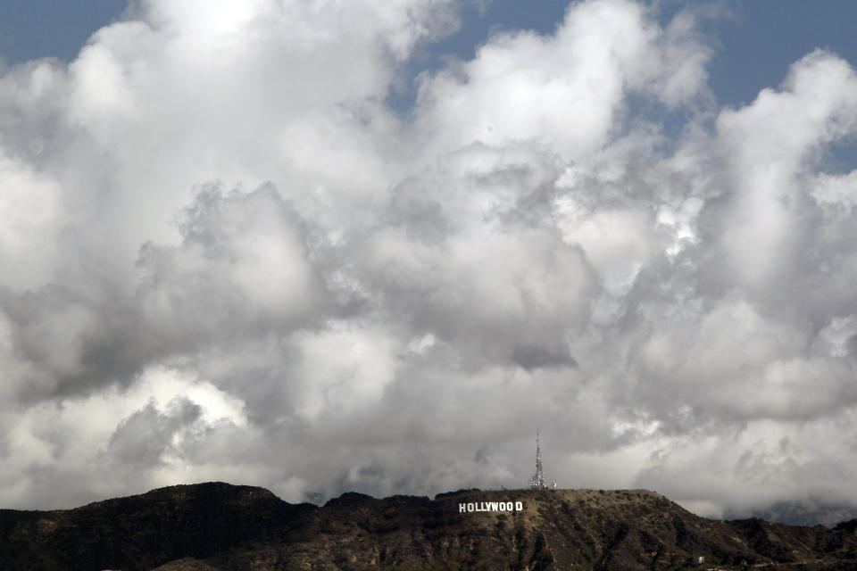 Clouds are shown over the iconic Hollywood sign Thursday Feb. 27, 2014 in Los Angeles. Southern California got an overnight soaking Thursday as residents prepared for a second, more powerful storm that could bring heavier rain and prompted fears of mudslides in communities along fire-scarred foothills. (AP Photo/Nick Ut)