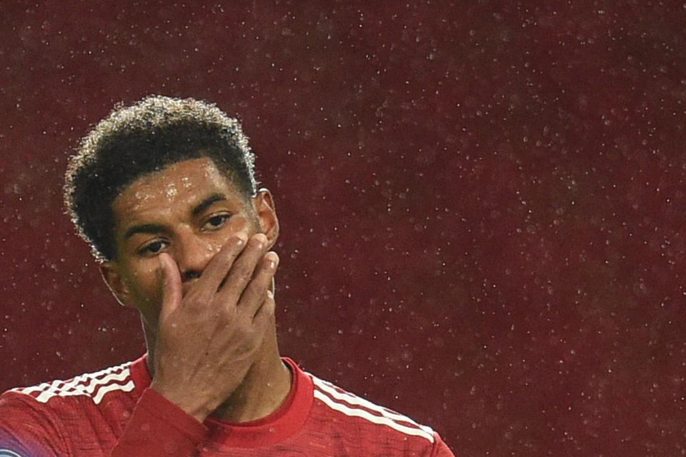 Manchester United's English striker Marcus Rashford (L) reacts during the English Premier League football match between Manchester United and Chelsea at Old Trafford in Manchester, north west England, on October 24, 2020. (Photo by Oli SCARFF / POOL / AFP) / RESTRICTED TO EDITORIAL USE. No use with unauthorized audio, video, data, fixture lists, club/league logos or 'live' services. Online in-match use limited to 120 images. An additional 40 images may be used in extra time. No video emulation. Social media in-match use limited to 120 images. An additional 40 images may be used in extra time. No use in betting publications, games or single club/league/player publications. /  (Photo by OLI SCARFF/POOL/AFP via Getty Images)