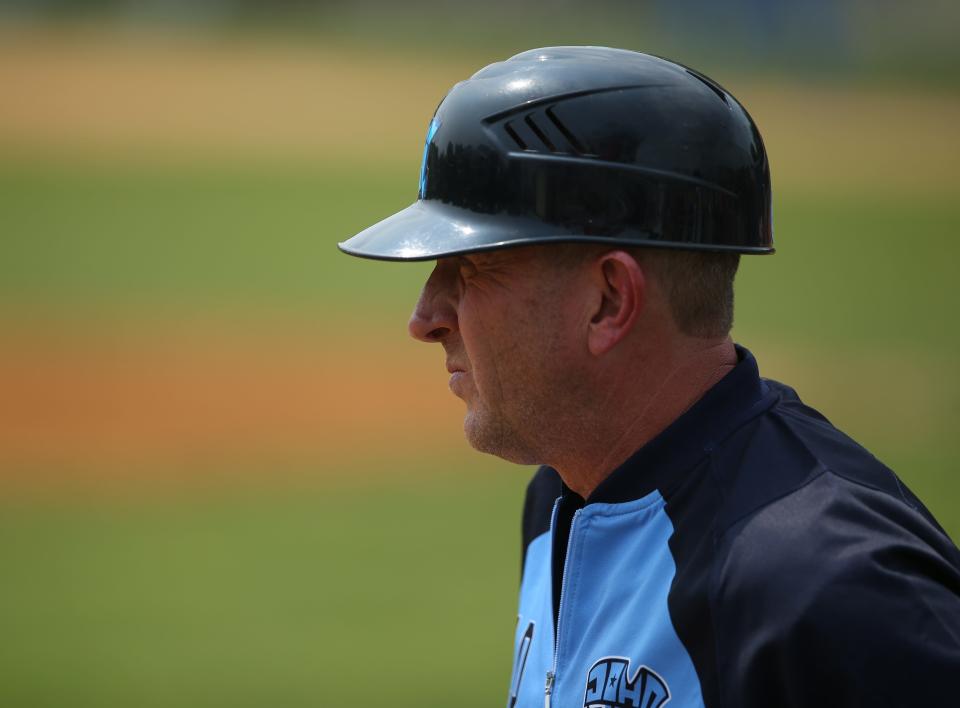 John Jay-East Fishkill baseball coach Eric Frink looks on as his team faces Roy C. Ketcham in a Section 1 Class AA semifinal on May 24, 2023.