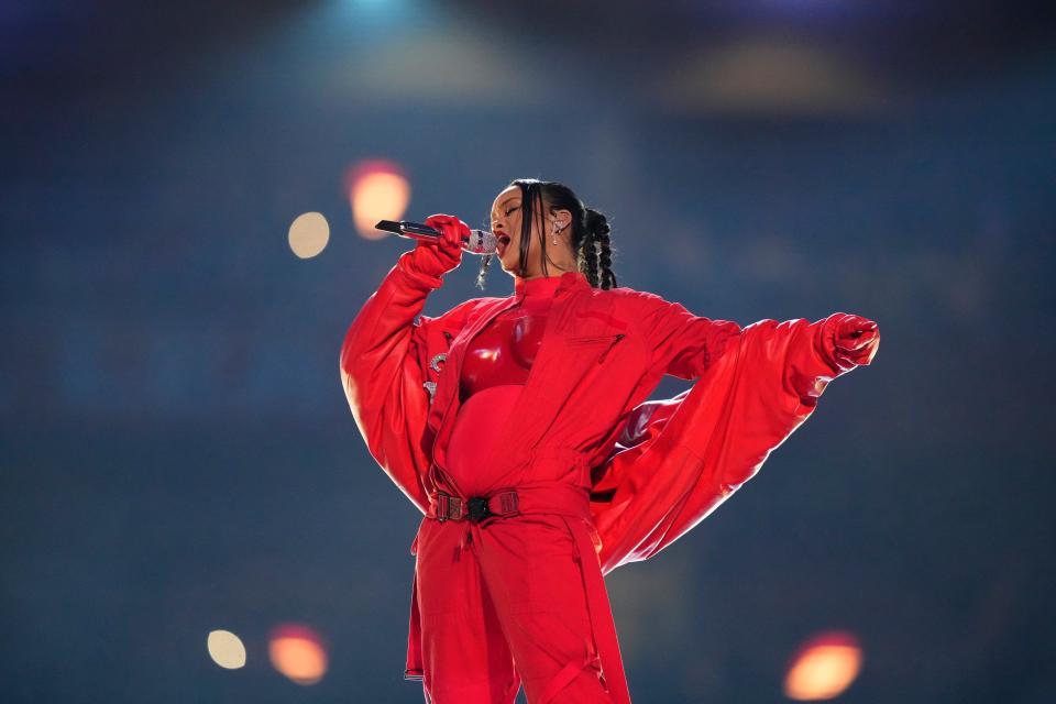 Rihanna tells British Vogue she was "geeked" for her Super Bowl performance after the birth of her son.