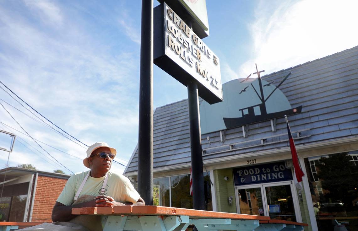 Ricky Moore, the chef and owner of Saltbox Seafood Joint, sits in the restaurant’s outdoor dining area on Monday, Nov. 14, 2022, in Durham. Moore won the 2022 James Beard Award for Best Chef: Southeast.