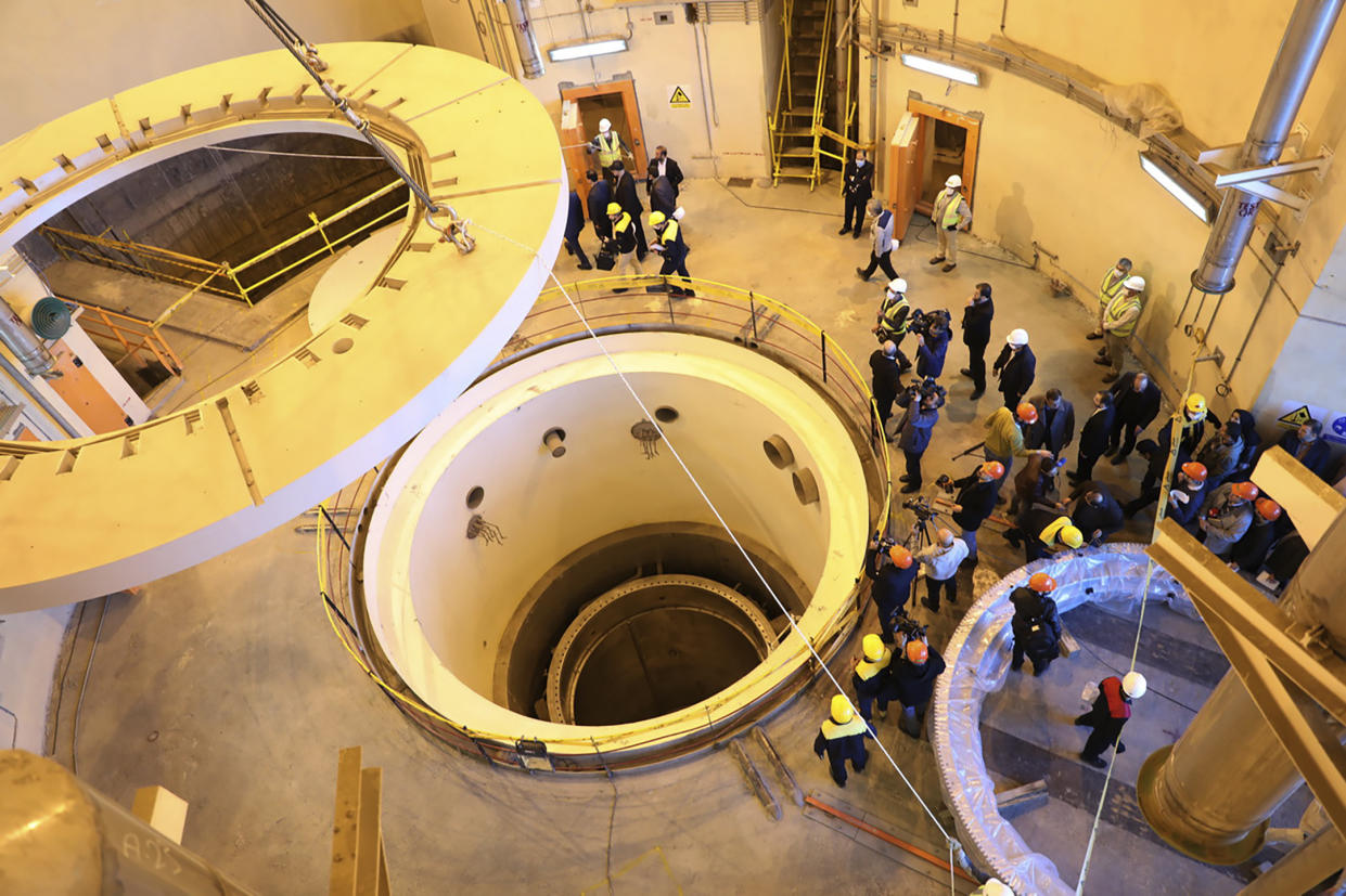 FILE - In this photo released by the Atomic Energy Organization of Iran, technicians work at the Arak heavy water reactor's secondary circuit, as officials and media visit the site, near Arak, 150 miles (250 kilometers) southwest of the capital Tehran, Iran, Monday, Dec. 23, 2019. A court in Iran on Thursday, June 23, 2022 ordered the United States government to pay over $4 billion to the families of Iranian nuclear scientists who have been killed in targeted attacks in recent years, state-run media reported. (Atomic Energy Organization of Iran via AP, File)