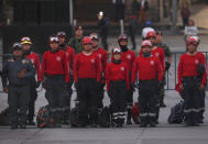 Rescue workers attend a ceremony marking the 34th anniversary of the 1985 earthquake, in the Zocalo plaza of Mexico City, Thursday, Sept. 19, 2019. The 8.1-magnitude earthquake killed as many as 10,000 and left thousands homeless. The date also commemorates the 2017 earthquake that rattled the city killing hundreds. (AP Photo/Marco Ugarte)