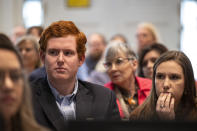 Buster Murdaugh, left, and his girlfriend Brooklynn White watch a video clip from Buster's brother Paul's phone in the double murder trial of Alex Murdaugh at the Colleton County Courthouse in Walterboro, S.C., Wednesday, Feb. 1, 2023. (Andrew J. Whitaker/The Post And Courier via AP, Pool)