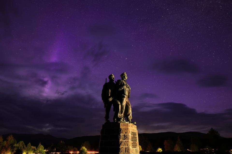 The Commando Memorial in Spean Bridge, Scotland as the aurora borealis, commonly known as the northern lights, are visible in the early hours on Sunday 12 May (Getty Images)