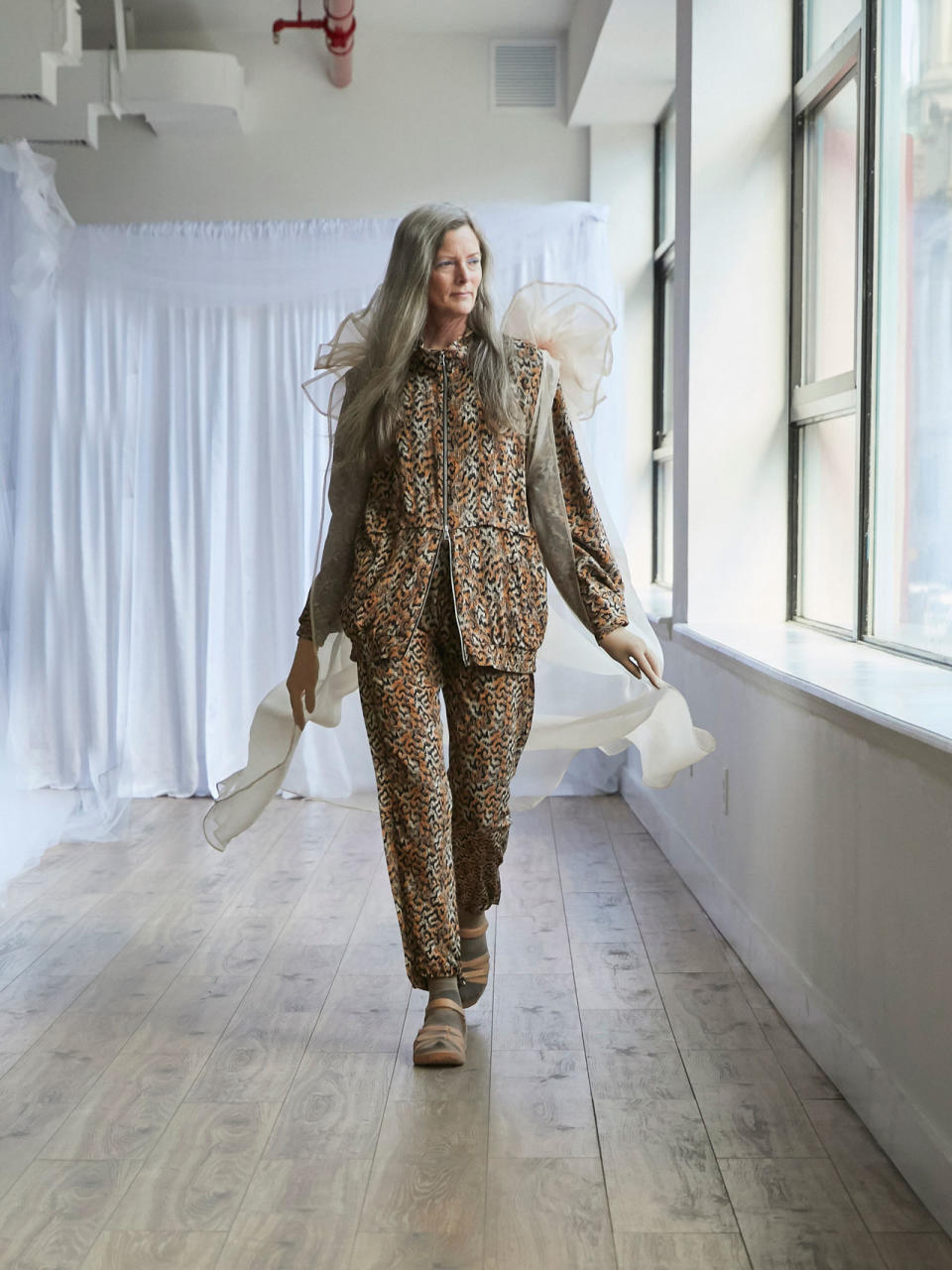 <p>Older female model wears leopard zip jacket and trouser set at the Collina Strada Fall/Winter 2018 show. (Photo: Jonathan Hokklo) </p>