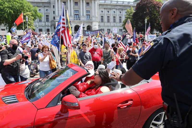 Protestors rally against coronavirus disease restrictions at the Pennsylvania Capitol in Harrisburg