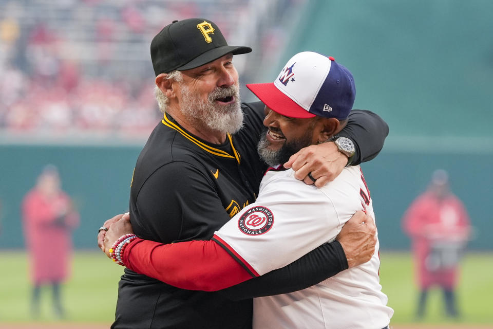 Pittsburgh Pirates manager Derek Shelton and Washington Nationals manager Dave Martinez embrace during introductions of an opening day baseball game at Nationals Park, Monday, April 1, 2024, in Washington. (AP Photo/Alex Brandon)