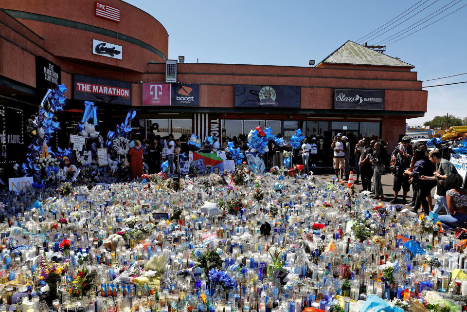 Image: People mourn the shooting death of musician Nipsey Hussle outside of The Marathon Clothing store on Slauson Avenue in Los Angeles (Patrick T. Fallon / Reuters file)