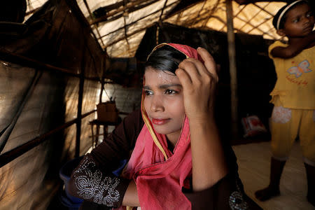 Ismat Ara, 15, a Rohingya refugee, sits in shelter in Kutupalong refugees camp in Cox's Bazar, Bangladesh, October 15, 2017. REUTERS/Zohra Bensemra