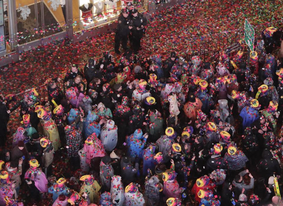 Confetti covers the crowd during the New Year's celebration in Times Square