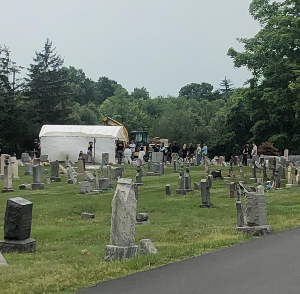 Law enforcement from Portage County work to exhume the body of Kathryn Menendez, a 17-year-old girl from Alliance who was killed in 1994. The body is being exhumed to enable DNA testing to be done. The technology was not available at the time she died.