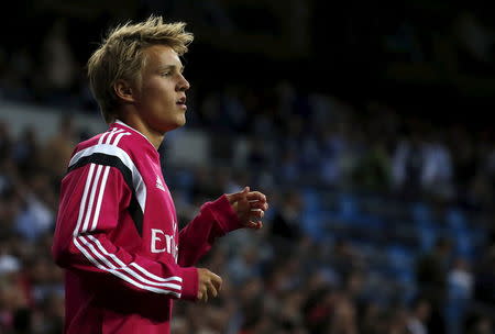 Real Madrid's Martin Odegaard warms up during their Spanish first division soccer match against Getafe at Santiago Bernabeu stadium in Madrid, Spain, May 23, 2015. REUTER/Juan Medina