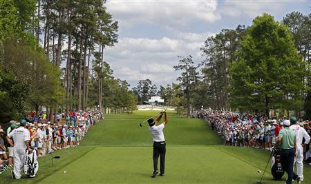 U.S. golfer Bubba Watson tees off on the seventh hole during the final round of the Masters golf tournament at the Augusta National Golf Club in Augusta, Georgia April 13, 2014. REUTERS/Jim Young