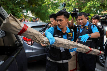 A Thai forensic expert puts an evidence as they leaves from a site of bomb blast at the Phramongkutklao Hospital, in Bangkok, Thailand, May 22, 2017. REUTERS/Athit Perawongmetha