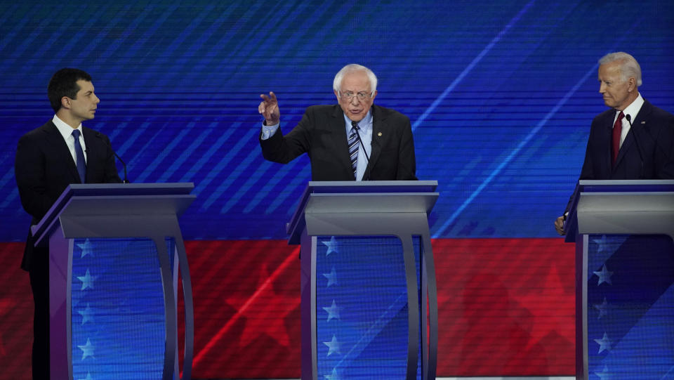 South Bend Mayor Pete Buttigieg, left, and former Vice President Joe Biden, right, listen as Sen. Bernie Sanders, I-Vt., center, speaks Thursday, Sept. 12, 2019, during a Democratic presidential primary debate hosted by ABC at Texas Southern University in Houston.&nbsp; (Photo: ASSOCIATED PRESS)