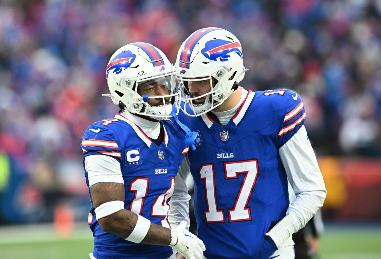 Josh Allen has a word with Stefon Diggs between plays during a game against the New England Patriots at Highmark Stadium on Dec. 31, 2023.