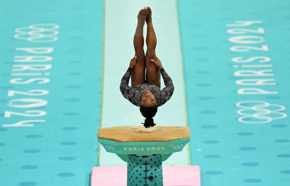 Jul 28, 2024; Paris, France; Simone Biles of the United States performs on the vault in women’s qualification during the Paris 2024 Olympic Summer Games at Bercy Arena. Mandatory Credit: James Lang-USA TODAY Sports