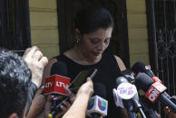 Karen Caballero, the mother of Fernando Redondo Caballero and Alejandro Andino Caballero who died near San Antonio, Texas, after being discovered in a hot trailer full of migrants being smuggled into the US, speaks during an impromptu conference at their home in Las Vegas, Honduras, Wednesday, June 29, 2022. Caballero's sons were among the bodies of 51 people discovered in what is believed to be the nation's deadliest smuggling episode on the U.S.-Mexico border. (AP Photo/Delmer Martinez)