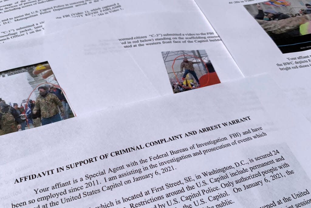 The affidavit from the FBI in support of an arrest warrant for Scott Kevin Fairlamb is photographed on Aug. 6, 2021. (AP Photo/Jon Elswick, File)