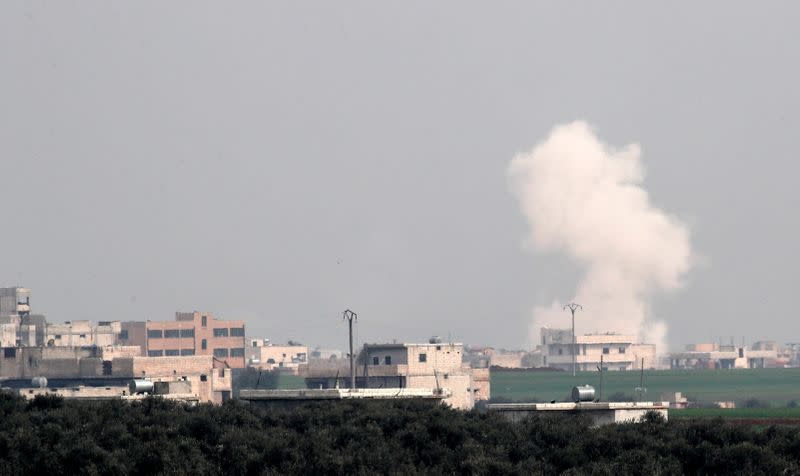 Smoke rises after an air strike in Saraqeb in Idlib province