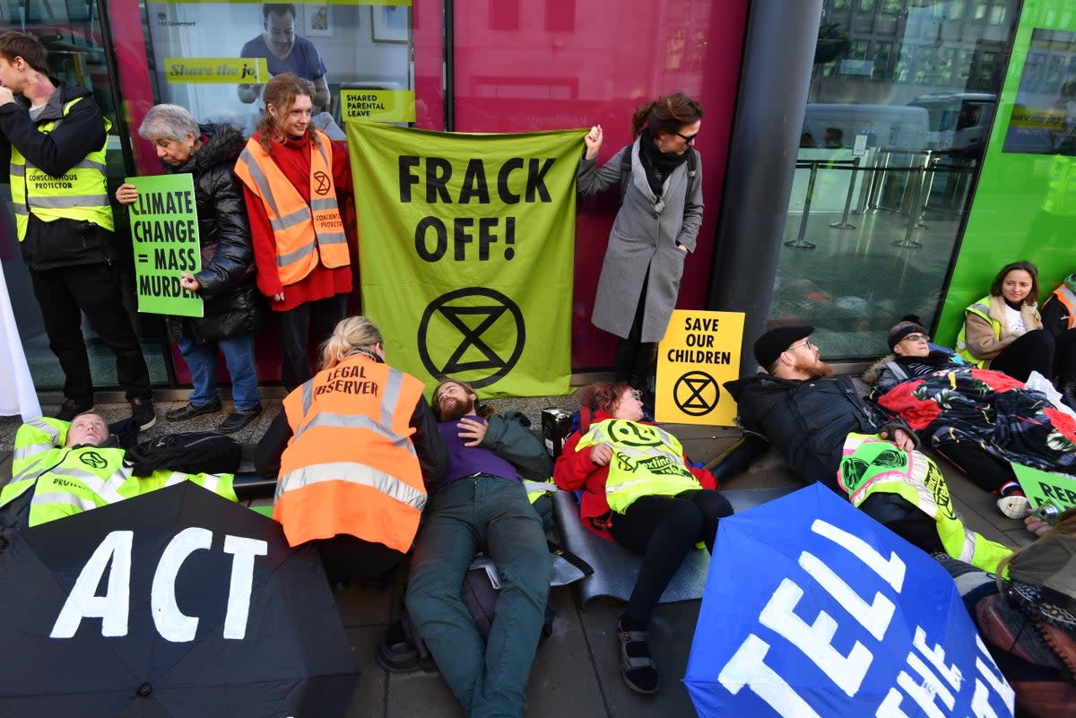 Activists from Extinction Rebellion stage an anti-fracking protest outside the Department for Business, Energy and Industrial Strategy in Westminster, London (John Stillwell/PA) (PA Archive)