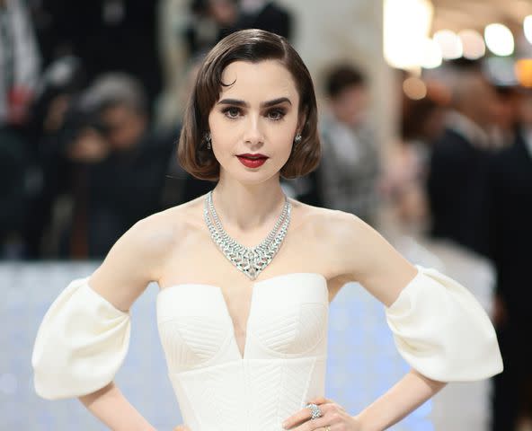 <p>Dimitrios Kambouris/Getty</p> Lily Collins attends the 2023 Met Gala on May 1, 2023 in New York City