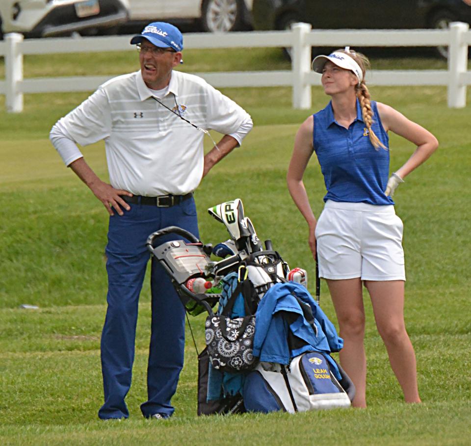 Aberdeen Central head coach Kim Zimmerman and player Leah Gough watch an approach shot to the No. 18 green during the final day of the 2022 state Class AA girls golf tournament at the Brookings Country Club.
