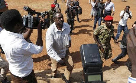 Ugandan army General David Sejusa (2nd L) arrives at military court in Makindye, a suburb of the capital Kampala, February 2, 2016, during his first court appearance following his detention last week. REUTERS/James Akena