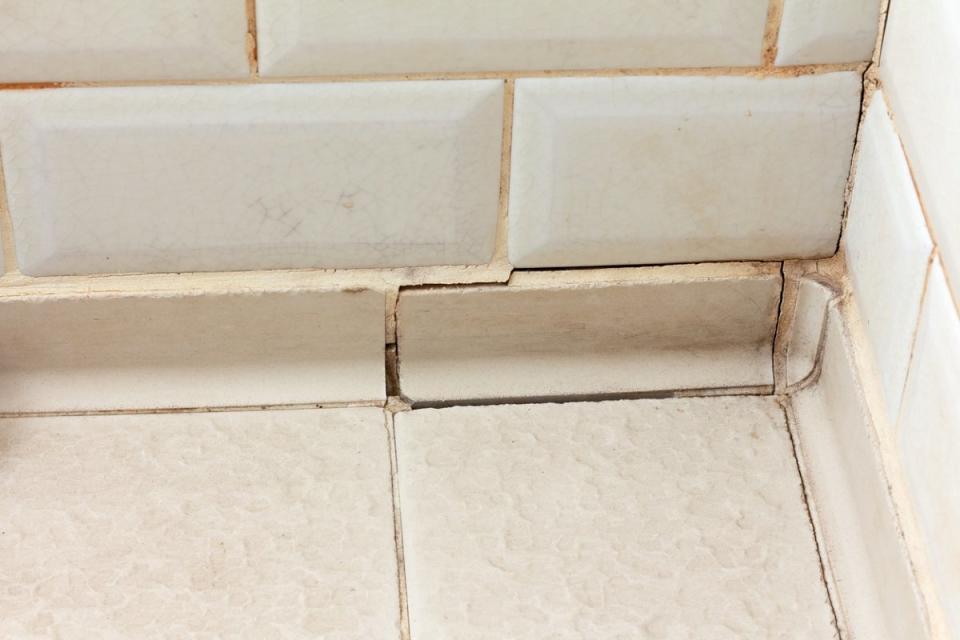Cracked grout in bathroom floor