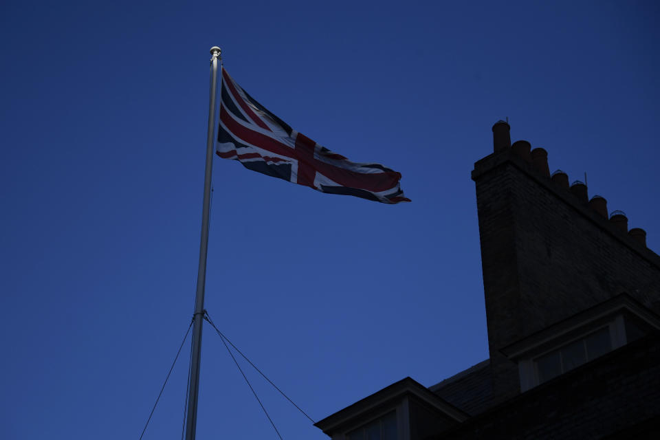 FILE - In this file photo dated Monday, Dec. 14, 2020, the Union Flag flies on the top of 10 Downing Street, the Prime Minister's official residence in London. The British government said Wednesday March 24, 2021, the national flag should be flown every day on all public buildings, the latest move in an increasing embrace of the Union flag. (AP Photo/Alberto Pezzali, FILE)