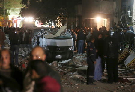 Damaged cars are seen at the scene of a bomb blast in Giza, Egypt, January 21, 2016. REUTERS/Mohamed Abd El Ghany