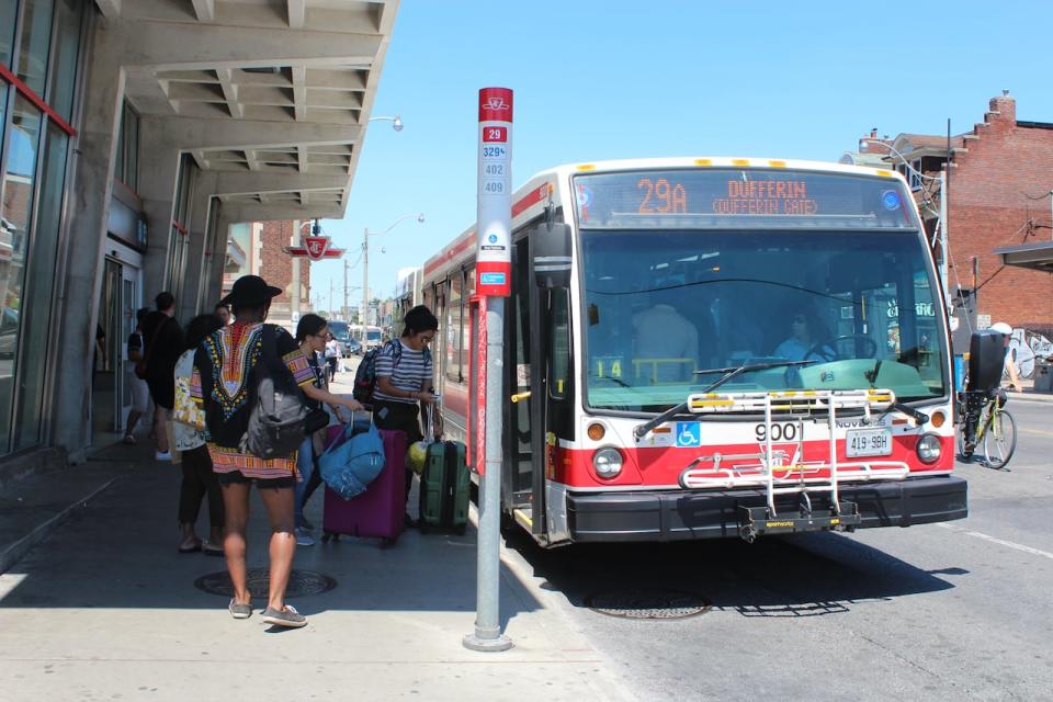 Dufferin Bus is known as one of the busiest, slowest bus routes in the city.  A city staff report to be considered by the council in February looks at having a dedicated bus lane to improve the experience for riders.  (Lauren Pelley/CBC - image credit)