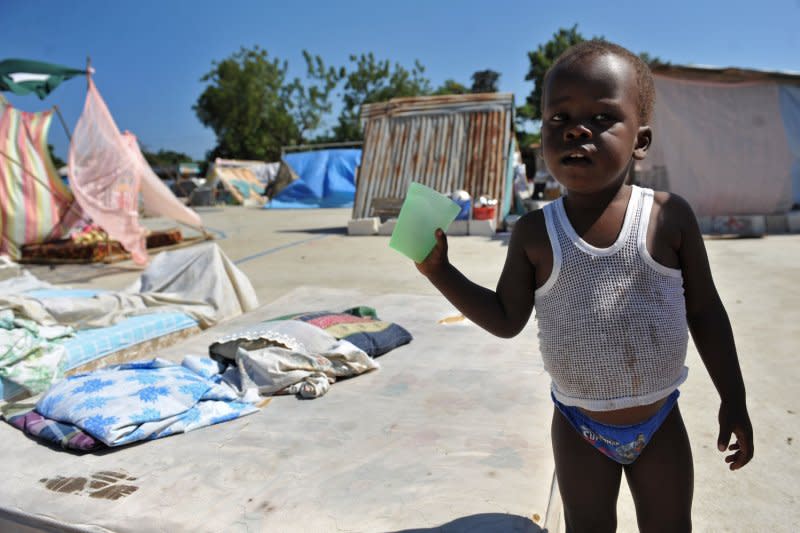 A young child is seen in a refugee camp in Grand Goave, Haiti, on January 22, 2010. On January 30, 2011, international aid groups said red tape and corruption in Haiti were withholding a massive array of supplies a year after a catastrophic earthquake struck the country. File photo by Kevin Dietsch/UPI