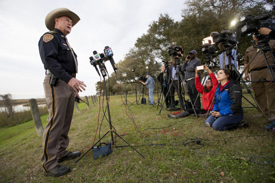 Chambers County Sheriff Brian Hawthorne gives an update on a plane crash in Trinity Bay during a news conference in Anahuac, Texas, Saturday, Feb. 23, 2019. A Boeing 767 cargo jetliner heading to Houston with a few people aboard disintegrated after crashing Saturday into the bay east of the city, according to a Texas sheriff. (Brett Coomer/Houston Chronicle via AP)