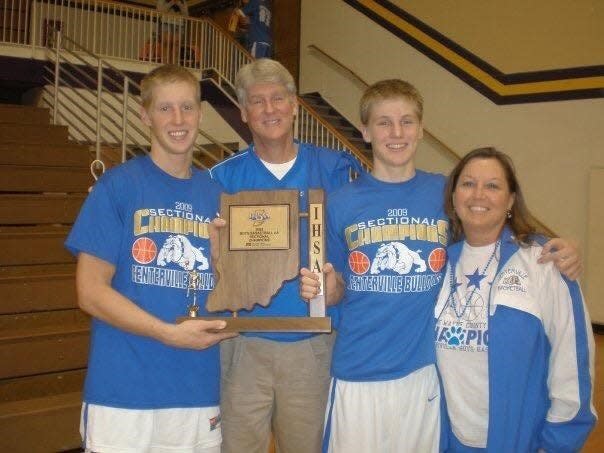 Drew Schauss (left) with father Rick, brother Matt and mother Beth after Centerville won the sectional championship in 2011.