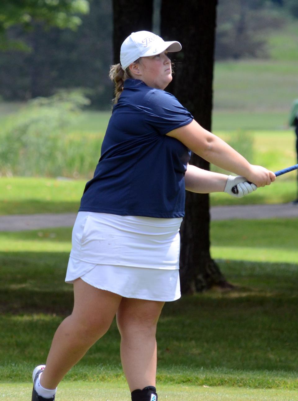 Rachel Fay of Petoskey follows her tee shot to begin Tuesday's round at The Highlands.