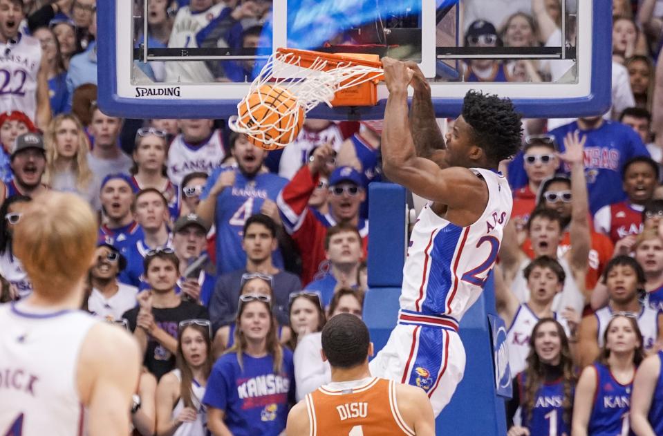 Kansas forward KJ Adams scores on a dunk during the first half of Monday night's 88-80 win over No. 5 Texas at Allen Fieldhouse in Lawrence, Kan. The Longhorns' lead in the Big 12 is now only a half-game ahead of No. 11 Iowa State.