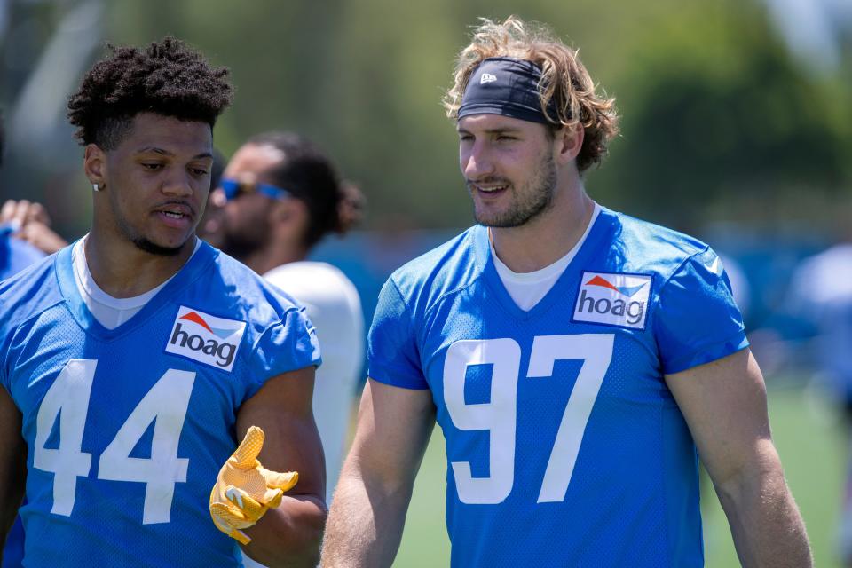 Los Angeles Chargers outside linebackers Jamal Davis II, left, talks with Joey Bosa walking off the field after drills at the team's practice facility in Costa Mesa, Calif., Wednesday, June 1, 2022.
