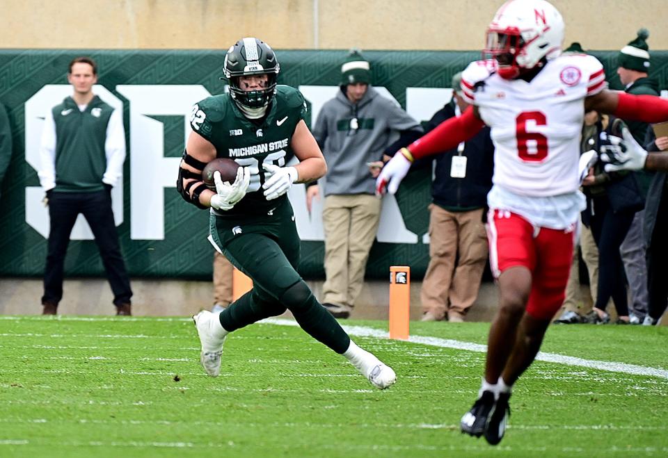 Michigan State tight end Brennan Parachek runs after Nebraska defensive back Quinton Newsome in the first quarter on Saturday, Nov. 4, 2023, in East Lansing.