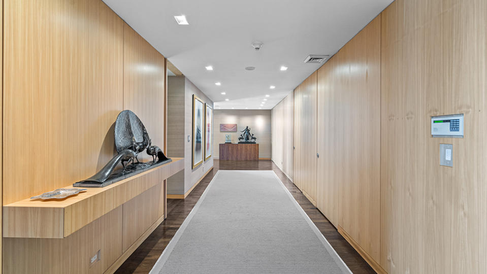 Gallery-like walls in the penthouse foyer - Credit: Living Proof/The Corcoran Group