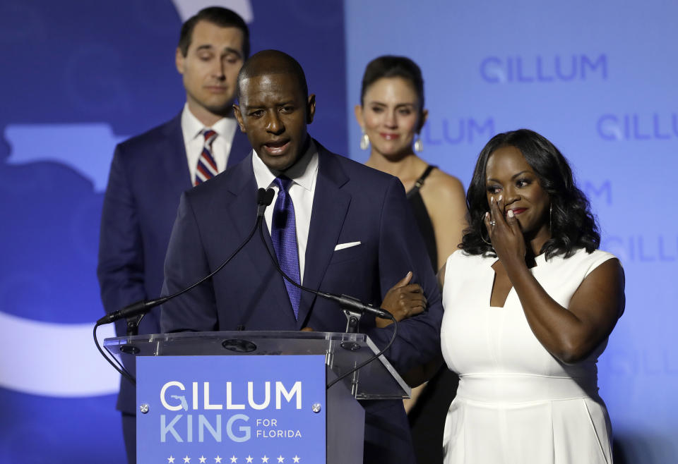 Florida Democratic gubernatorial candidate Andrew Gillum gives his concession speech as he is joined on stage by his wife R. Jai Gillum, right, and running mate Chris King and his wife Kristen Tuesday, Nov. 6, 2018, in Tallahassee, Fla. Gillum lost the Florida governor’s race to Republican Ron DeSantis. (AP Photo/Chris O'Meara)