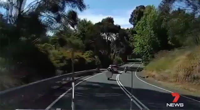 Two motorbikes narrowly miss an oncoming van. Source: 7 News