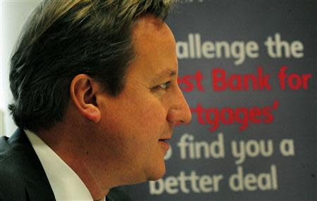 Britain's Prime Minister David Cameron speaks to staff and customers during a visit to Nat West Bank in Northampton, central England October 8, 2013. REUTERS/Rui Vieira/Pool