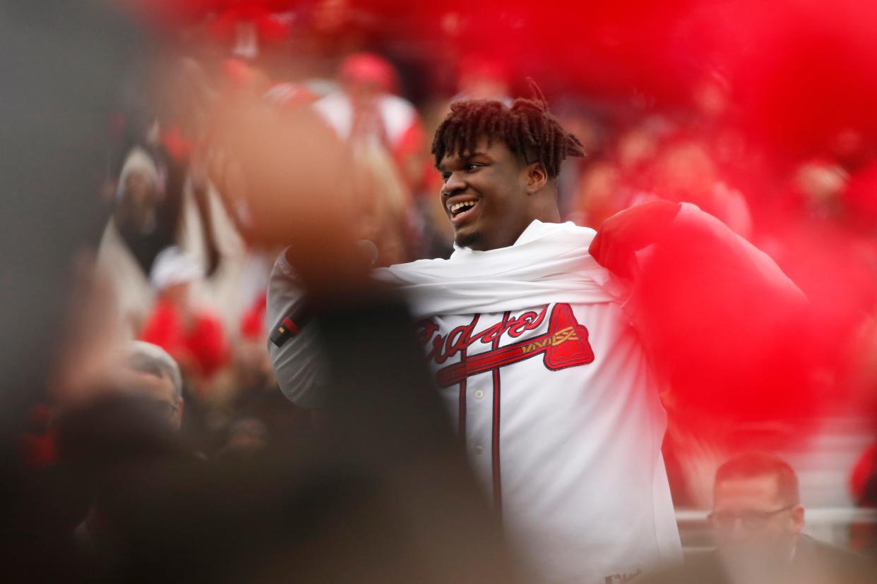 Georgia defensive lineman Jordan Davis honers Atlanta Braves during the the national championship celebration at Sanford Stadium in Athens, Ga., on Saturday, Jan. 15, 2022.