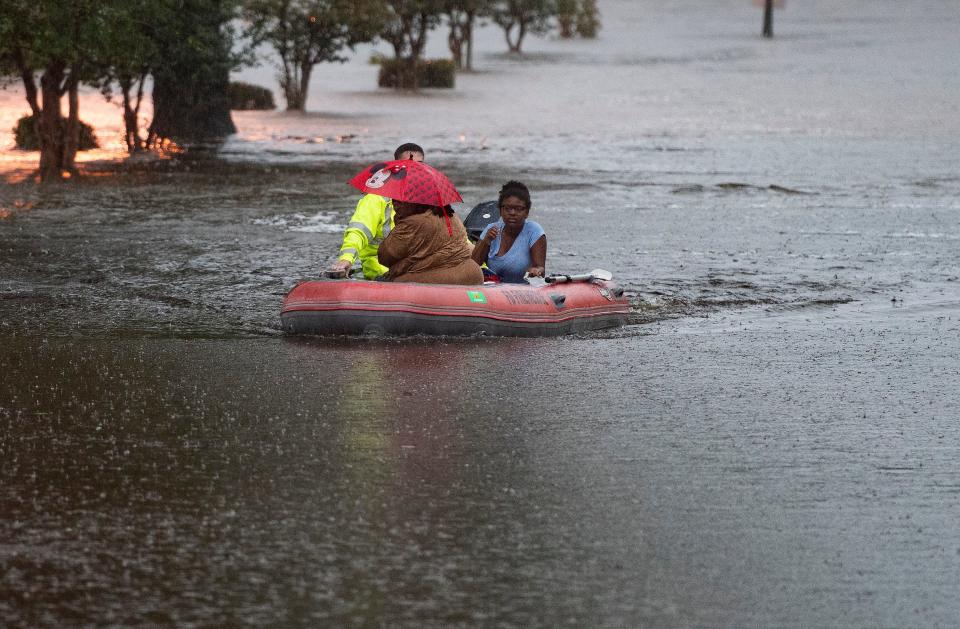 Escambia Fire Rescue works to rescue flood victims from the Forest Creek Apartment Complex after heavy rain dumped several inches of water along the Gulf Coast area on Friday, June 16, 2023. 