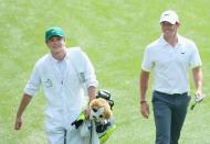 <p>Rory McIlroy walks alongside his caddie, Niall Horan, during the Par 3 Contest prior to the start of the 2015 Masters Tournament.</p>