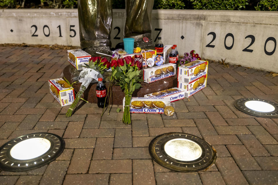 The statue of Alabama football coach Nick Saban, along the Walk of Champions at Bryant-Denny Stadium, is the scene of gift drop-offs, Wednesday, Jan. 10, 2024, in Tuscaloosa, Ala. Saban, who won seven national championships — more than any other major college football coach — and turned Alabama back into a national powerhouse with six of those titles in just 17 seasons, is retiring, according to multiple outlets. (AP Photo/Vasha Hunt)