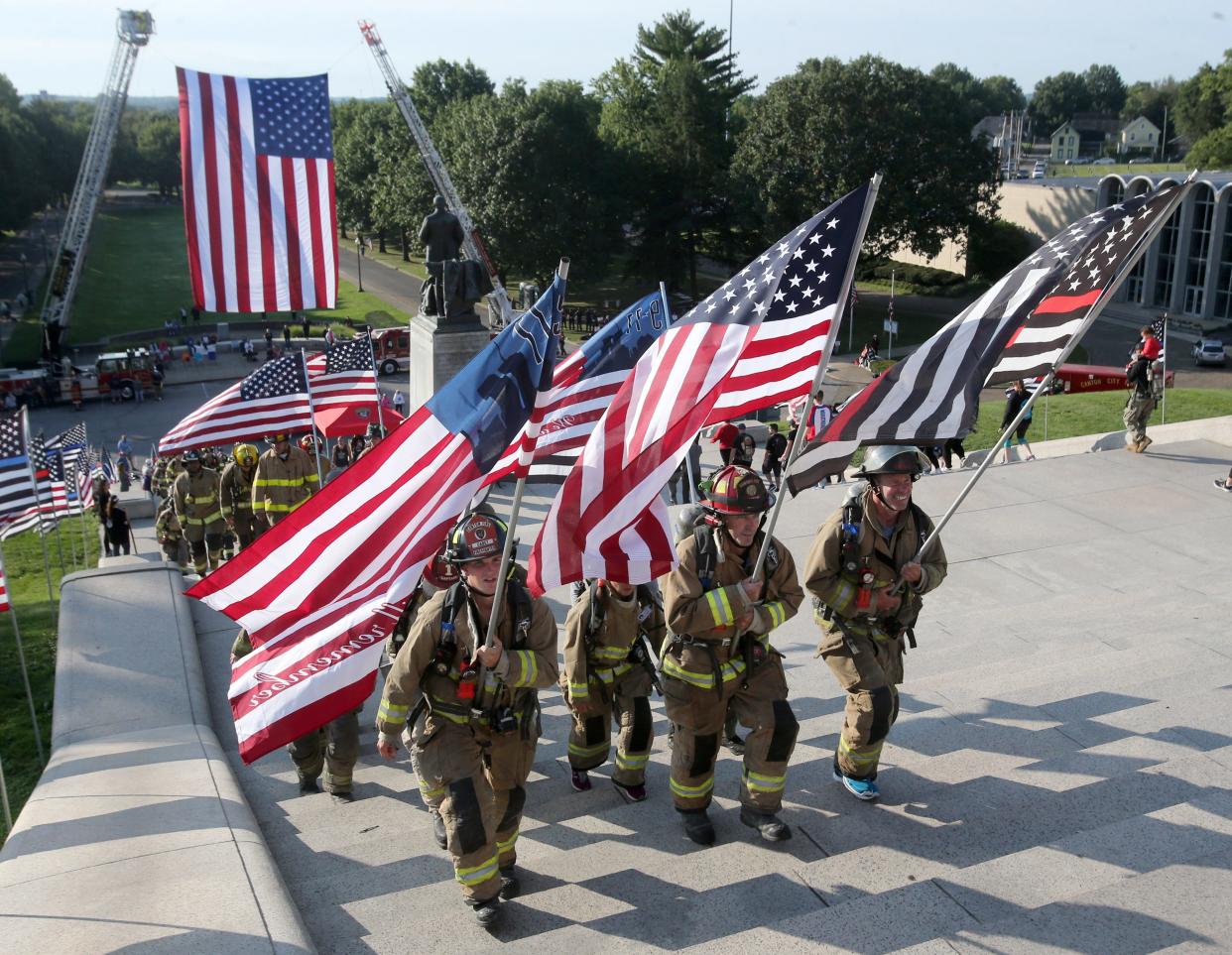 Firefighters participate in the Memorial Climb on the steps of the McKinley Presidential Library & Museum in Canton on Saturday. The event marked the 20th anniversary of the 9/11 attacks and recalled the memory of the 343 firefighters who lost their lives that day.