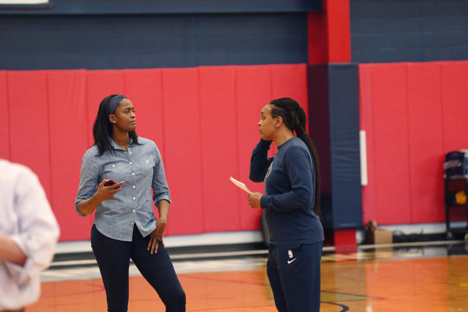 New Orleans Pelicans vice president of basketball operations Swin Cash, left, talks with two-way player development coach Teresa Weatherspoon at their NBA basketball training facility in Metairie, La., Wednesday, Jan. 15, 2020. (AP Photo/Gerald Herbert)